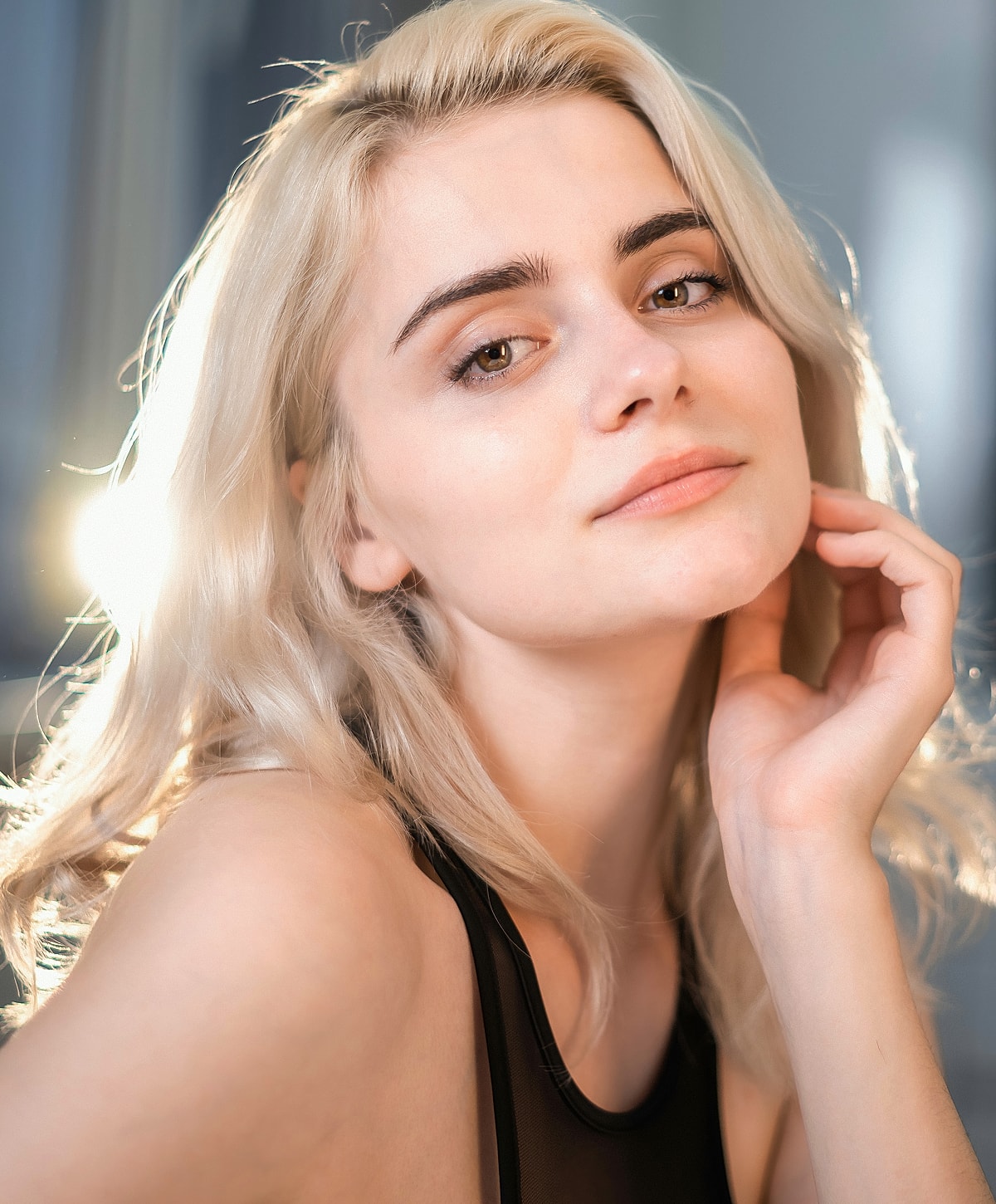 Portrait of a young woman with blonde hair.