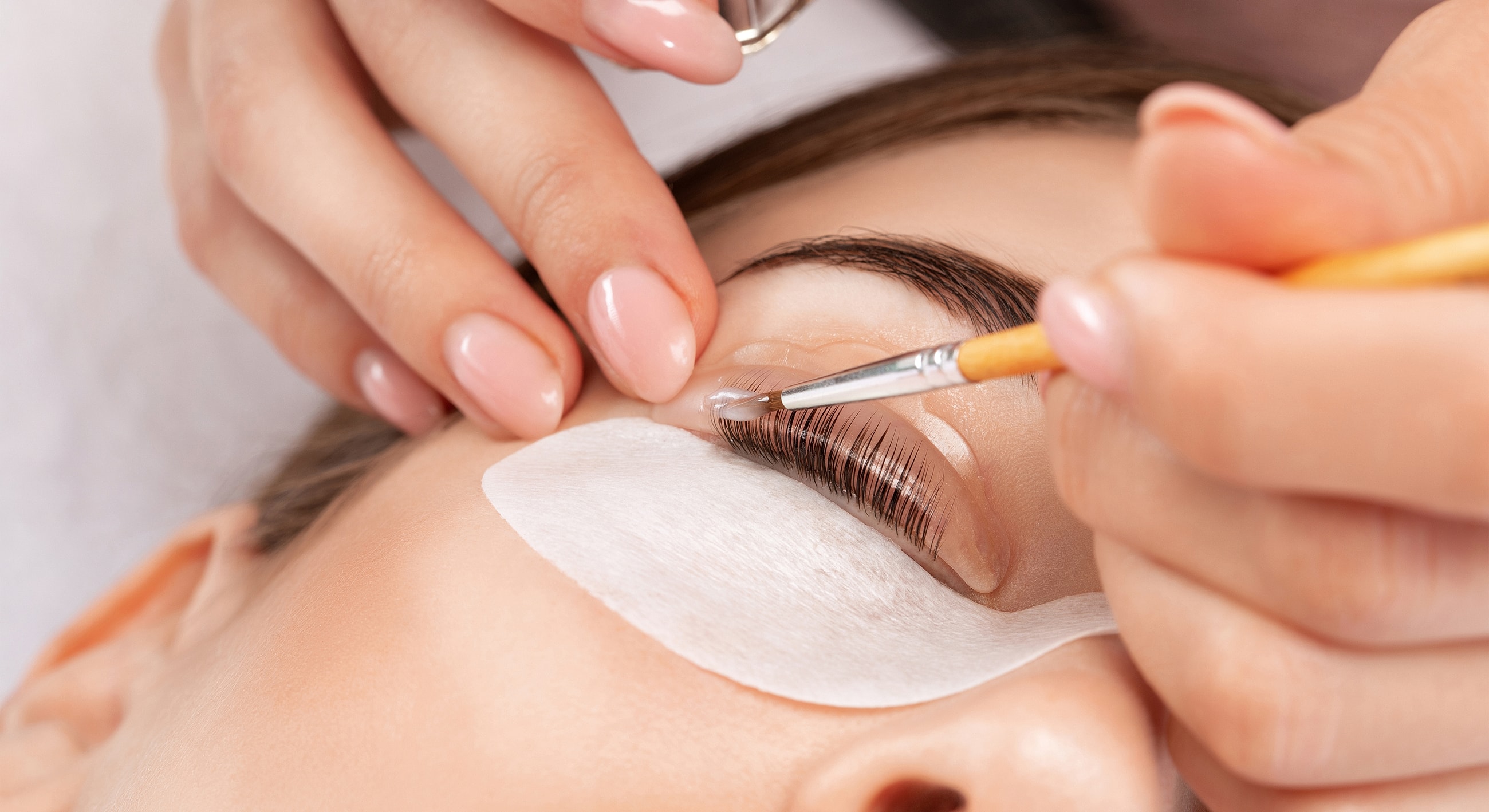 Applying eyelash treatment at a beauty salon.