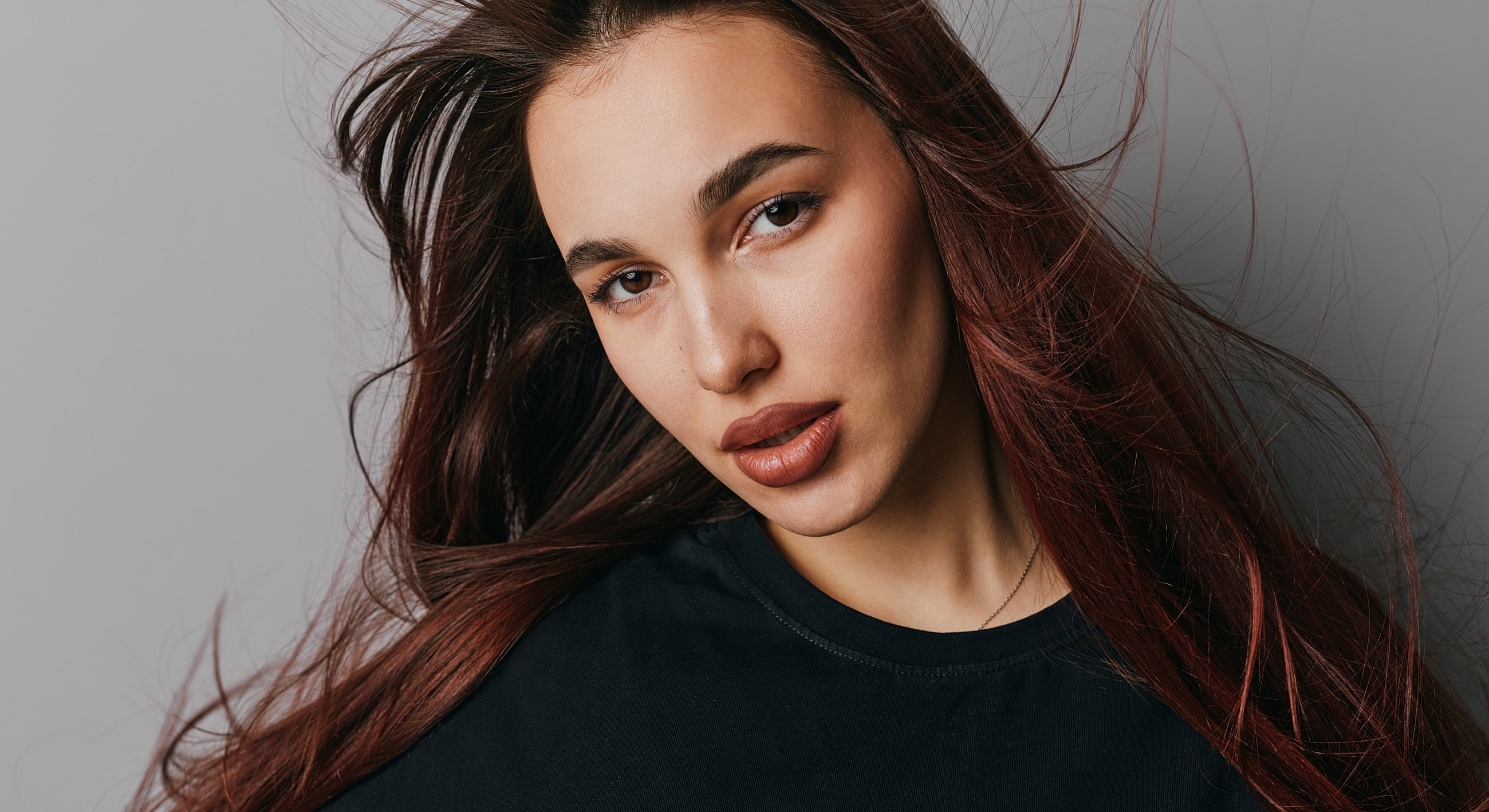 Portrait of a woman with flowing hair.