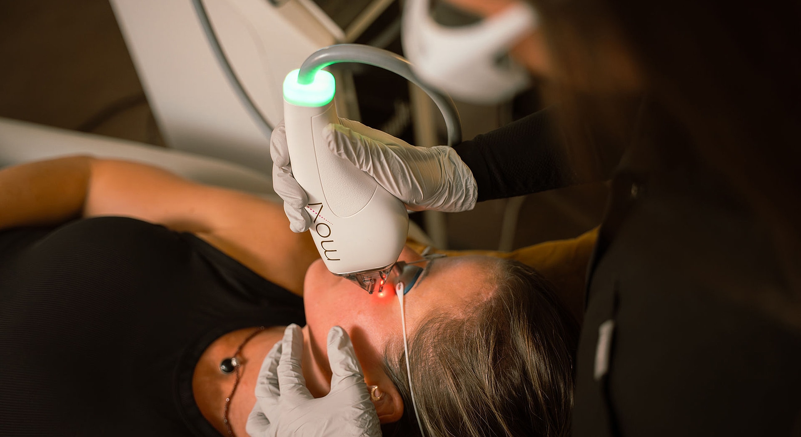 Laser treatment being administered to a patient.