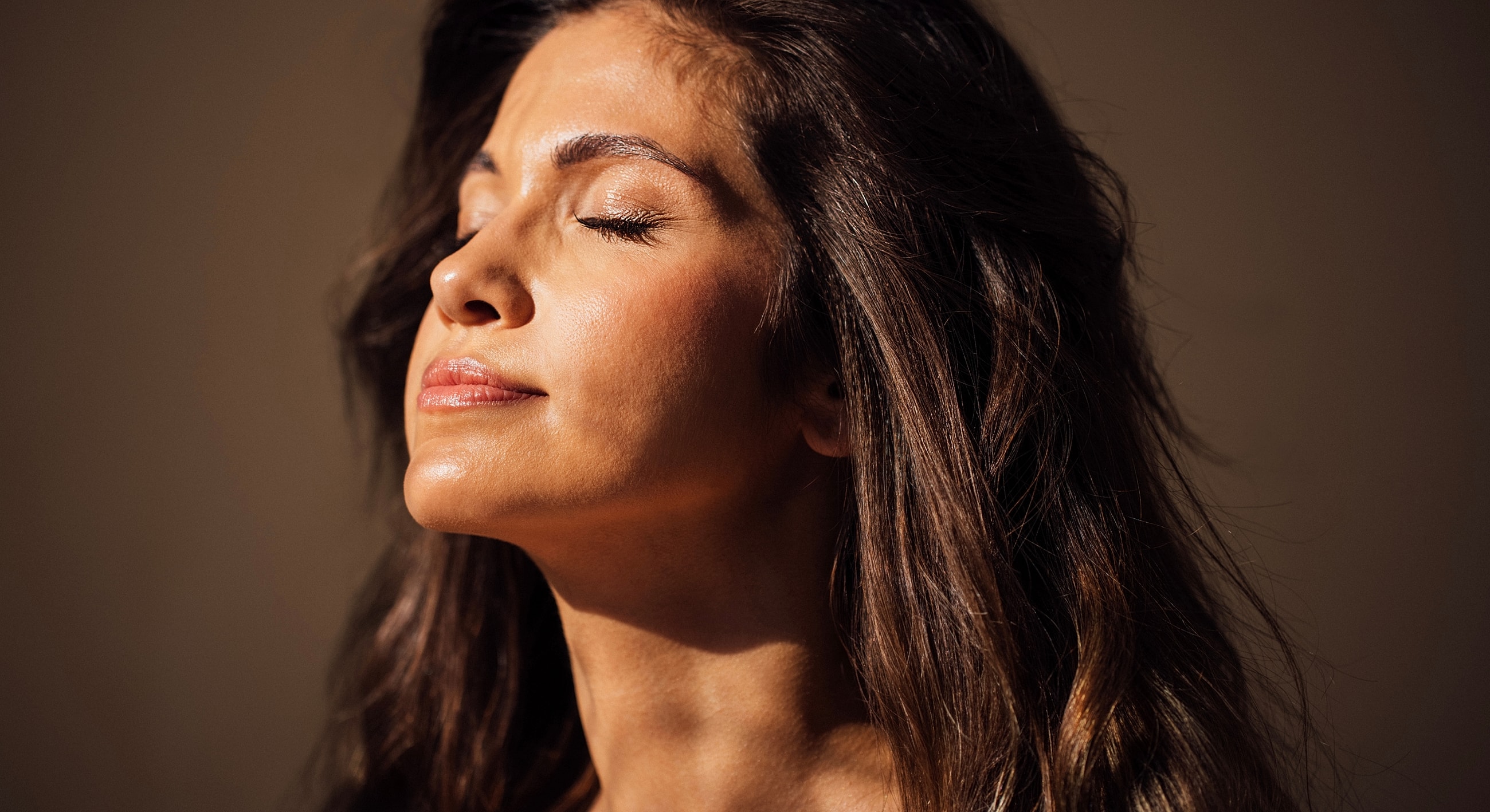 Woman with closed eyes and relaxed expression.